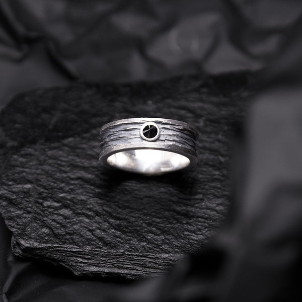 wide band ring for men in black silver, textured and reverse-set black diamond. 
