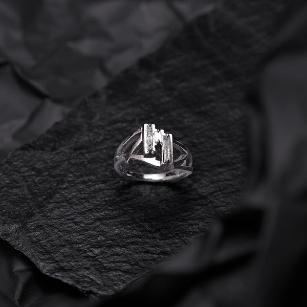 dark gold ring with grey baguette diamonds