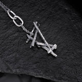 black silver chain necklace and black silver pendant with intertwined twigs