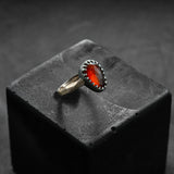 custom made ring, unique piece, contemporary design, red gold and black silver with a garnet center stone
