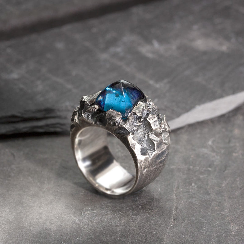 Massive textured silver and blue topaz sugarloaf ring