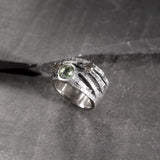 large ring in textured silver with aquamarine and tourmalines