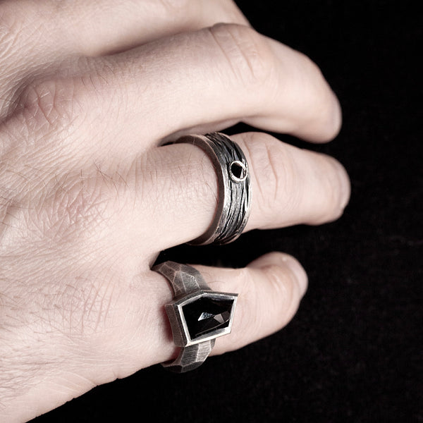 wide band ring for men in black silver, textured and reverse-set black diamond.