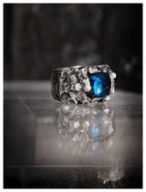 Massive textured silver and blue topaz sugarloaf ring