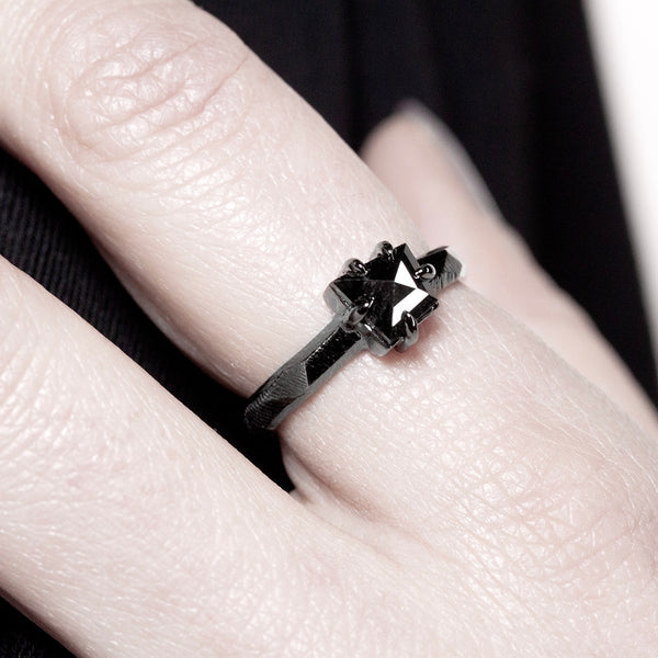 solitaire engagement ring in dark gold and black diamond