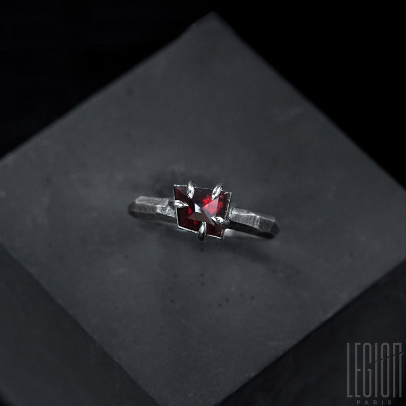 Contemporary Legion Paris ring with a red garnet centre stone in 925 silver.