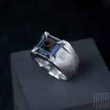Side view of a massive 925 silver Legion Paris with a blue and brown pietersite stone set by 4 claws 