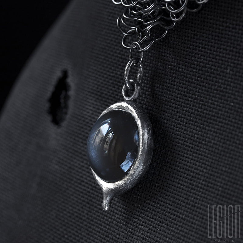 Side view of a grey moonstone on a black silver 925 Legion Paris chainmail necklace