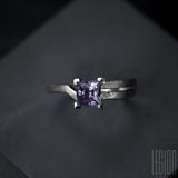 Close-up of a square cut purple spinel on a contemporary Legion Paris ring in white gold 750
