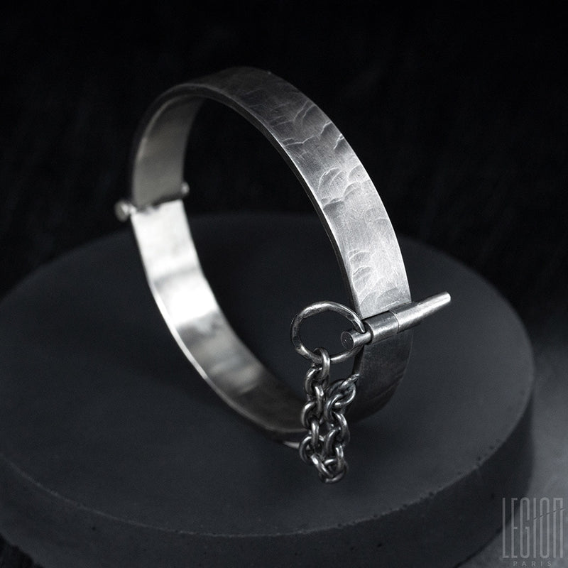 pin on black silver bracelet
