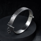 side view black silver bangle with pin