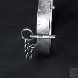 close-up of a black silver pin 