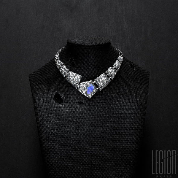 Black fabric bust with a black silver plastron necklace made of different textured black silver tiles with a raw black opal in the center