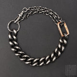 black silver chain bracelet. big round chainmail and round forcat chain which passes in double in a red gold ring. 