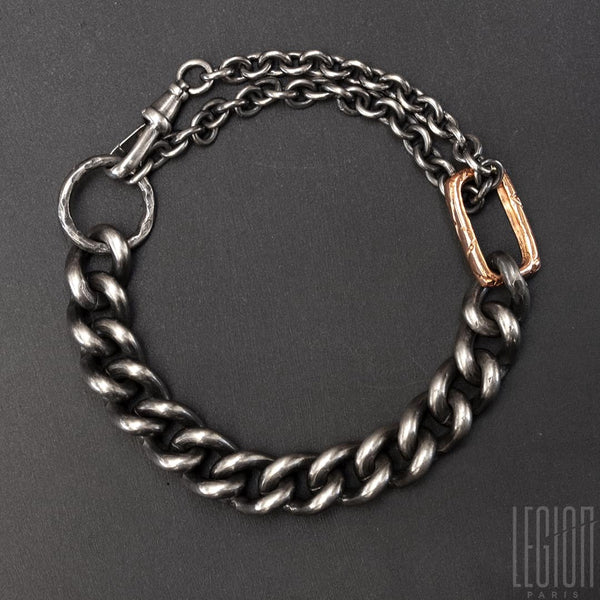 black silver chain bracelet. big round chainmail and round forcat chain which passes in double in a red gold ring. 