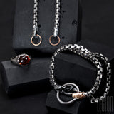 bracelet double turns in black silver and red gold, venitian chain and two snake heads. 