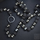close-up of black pearls from a necklace